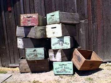large photo of stack of vintage wooden grape crates