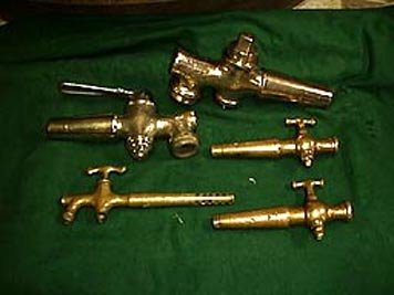 large photo of vintage brass spigots